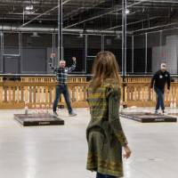 An alumnus knocking down pins at the Fowling Fun Event
